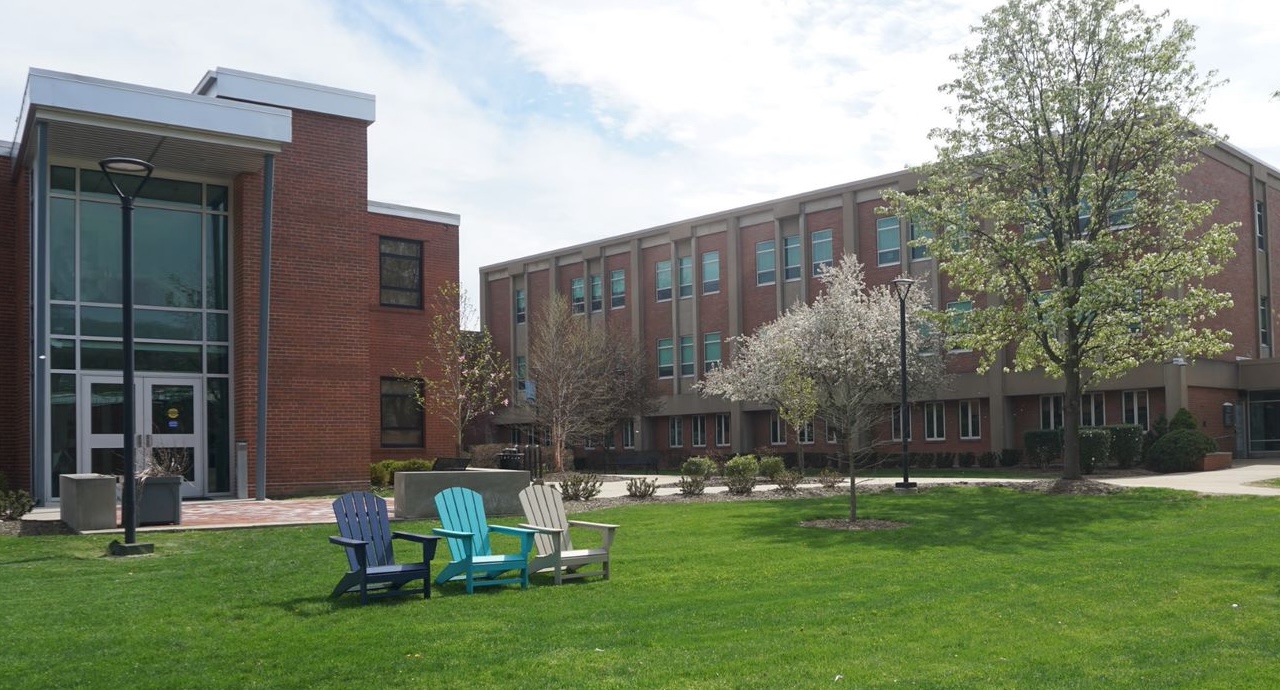 Wide photo of a lawn on the Greater Allegheny campus